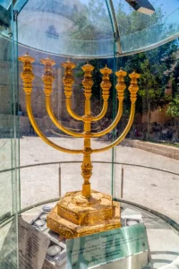 The model of the Temple Menorah next to the Temple Institute